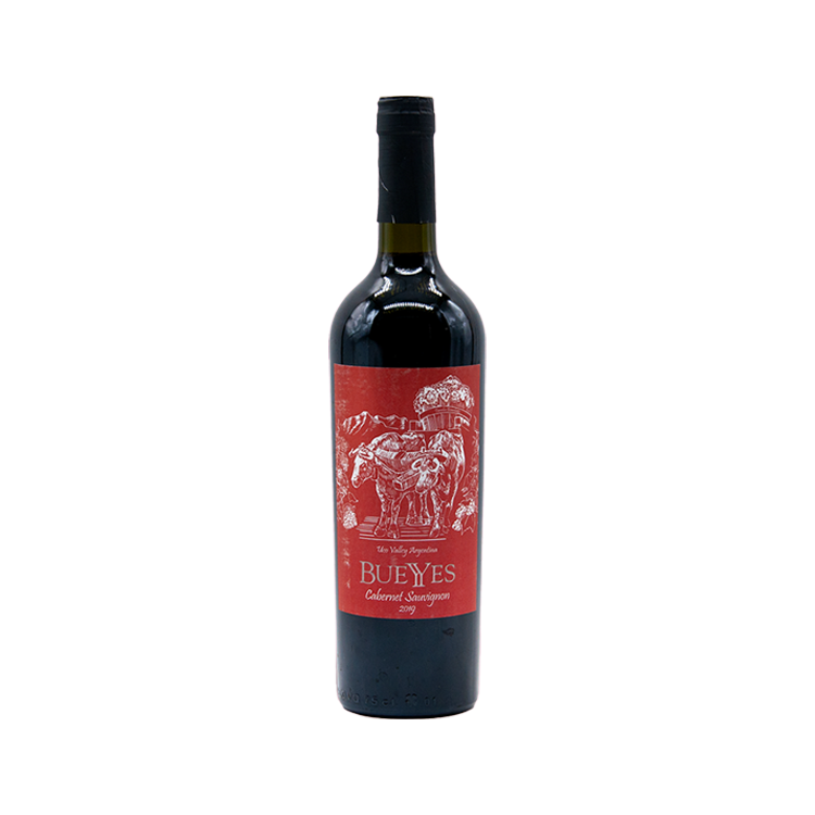 A bottle of Bueyes Cabernet Sauvignon wine with a label depicting an illustration of a bull and some grapes, predominantly in red color.